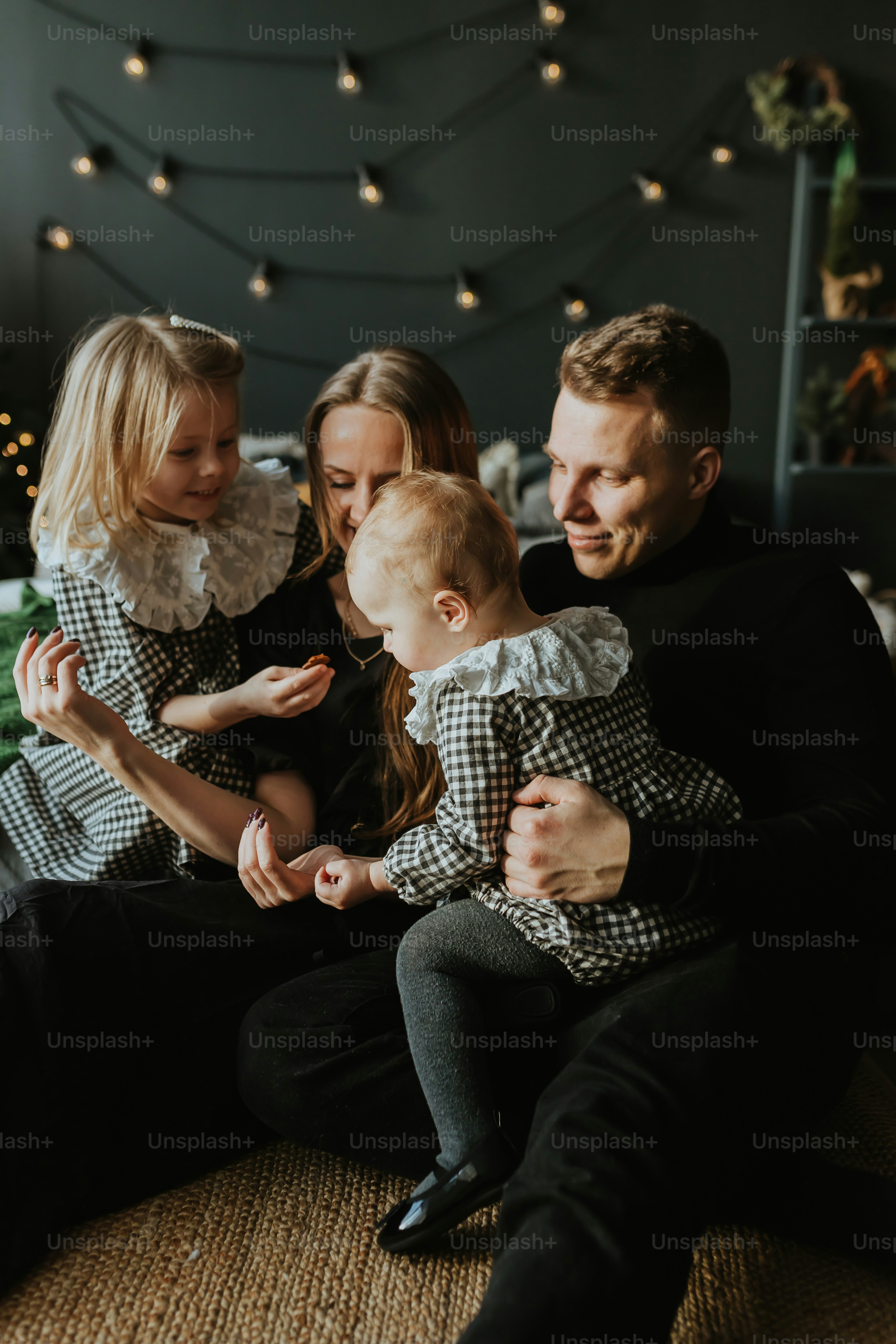 a family of three sitting on a couch together