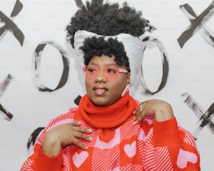 a woman in a red and white sweater with a white bow on her head