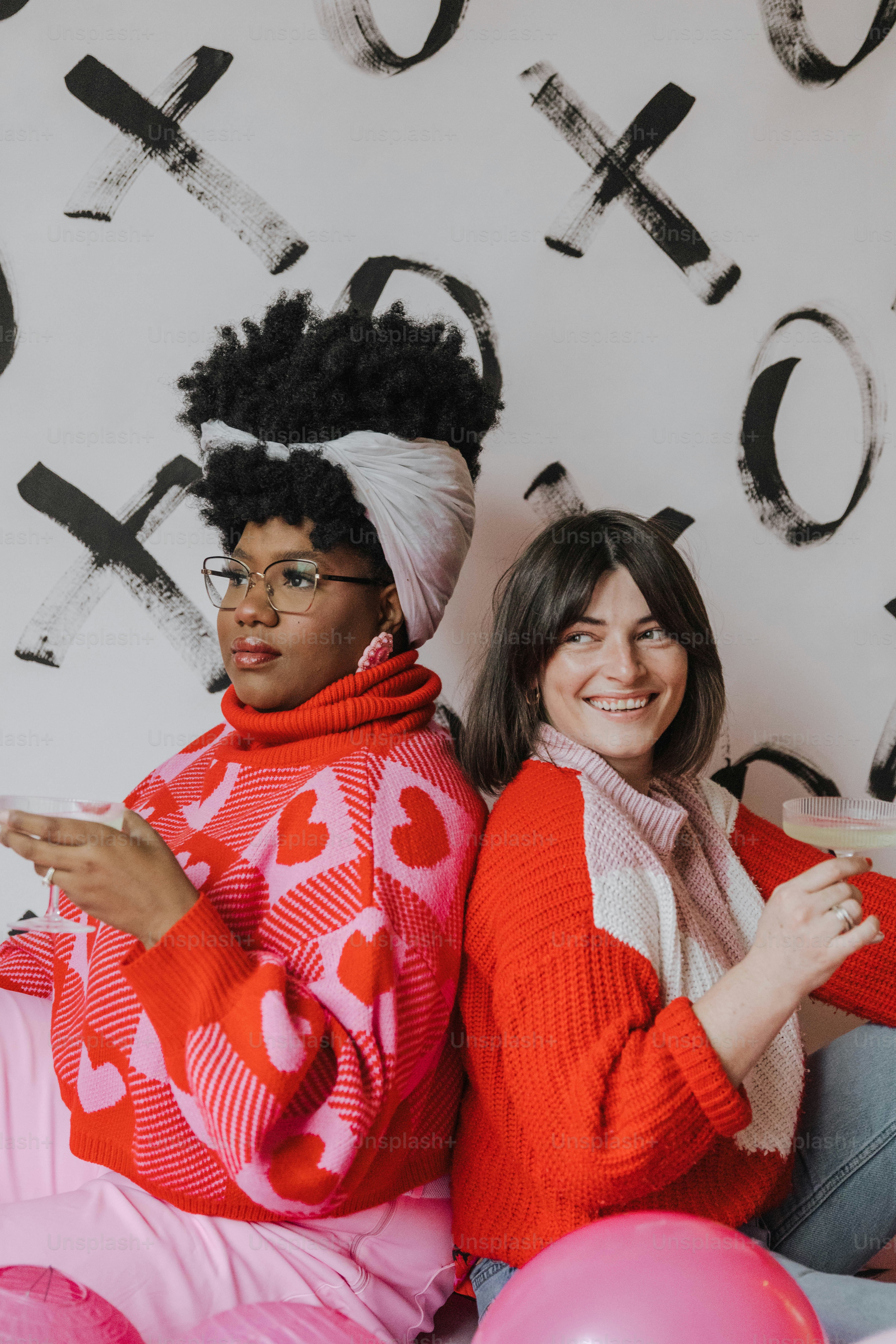 a couple of women sitting next to each other