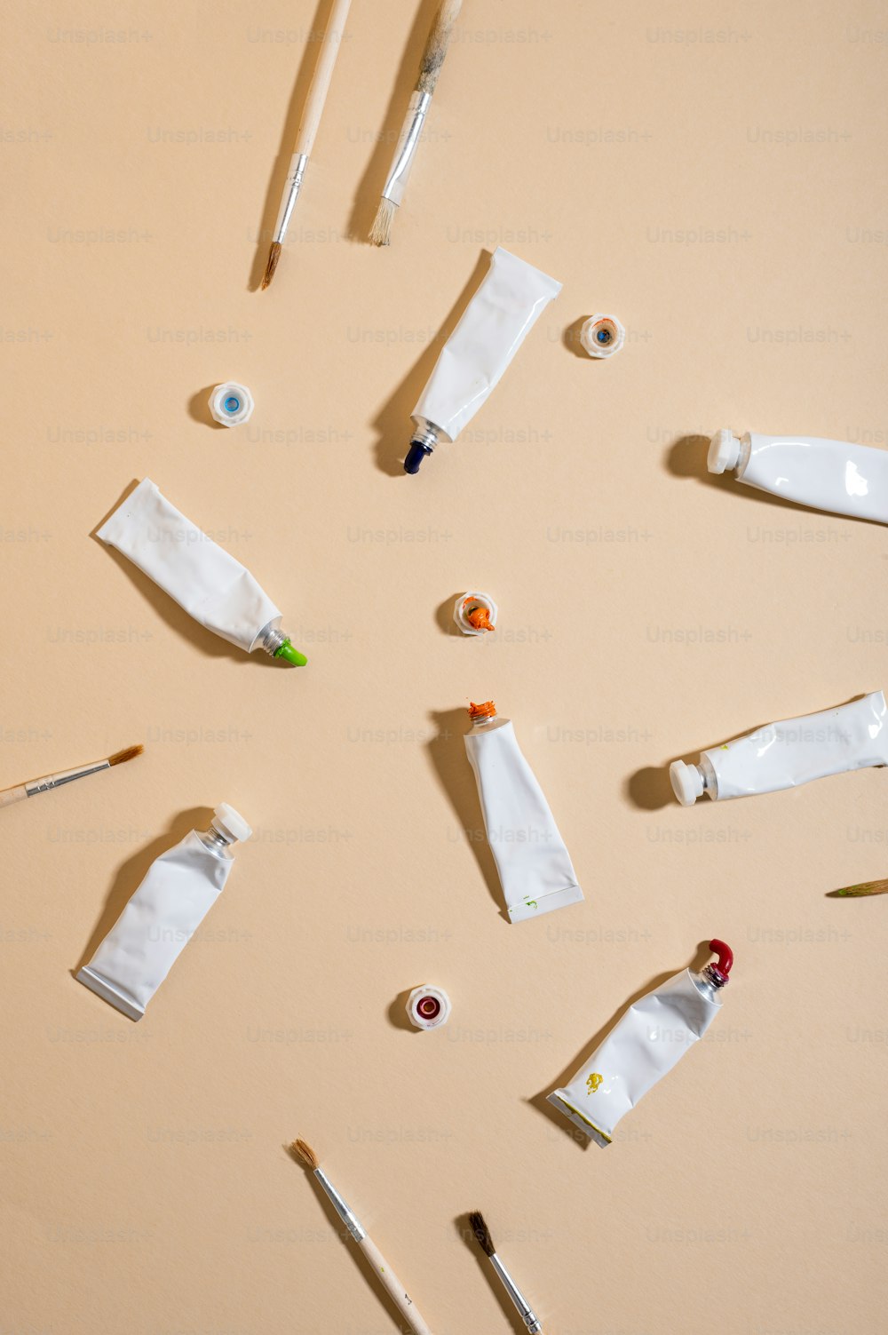 a collection of art supplies laid out on a table