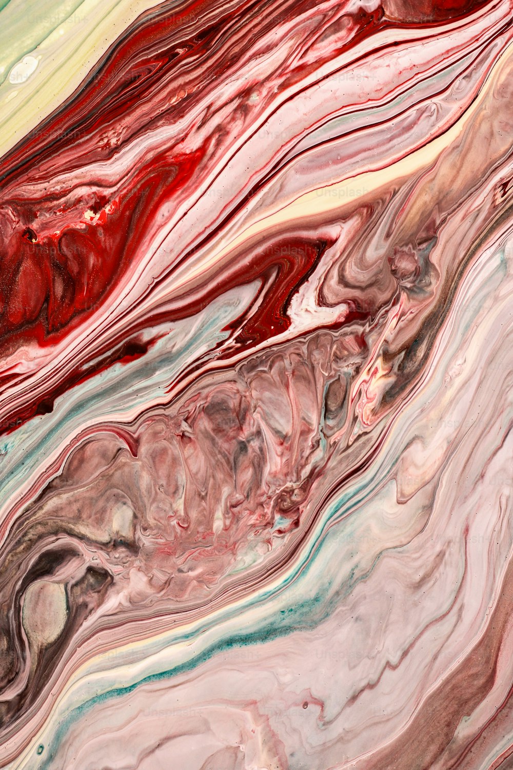 a close up of a red, green, and blue marble