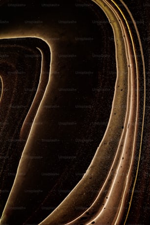 an abstract photograph of a curved road