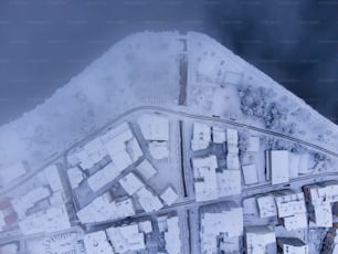 an aerial view of a city in the snow