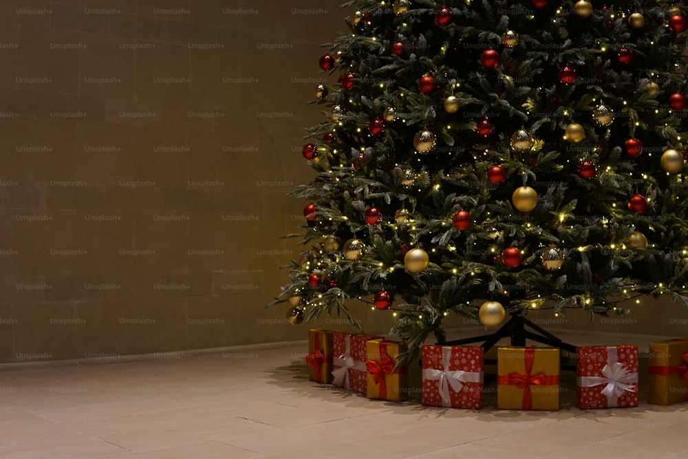 a decorated christmas tree with presents under it