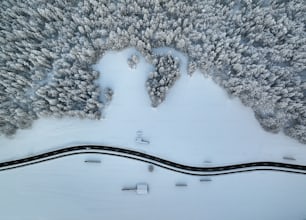 an aerial view of a snow covered road