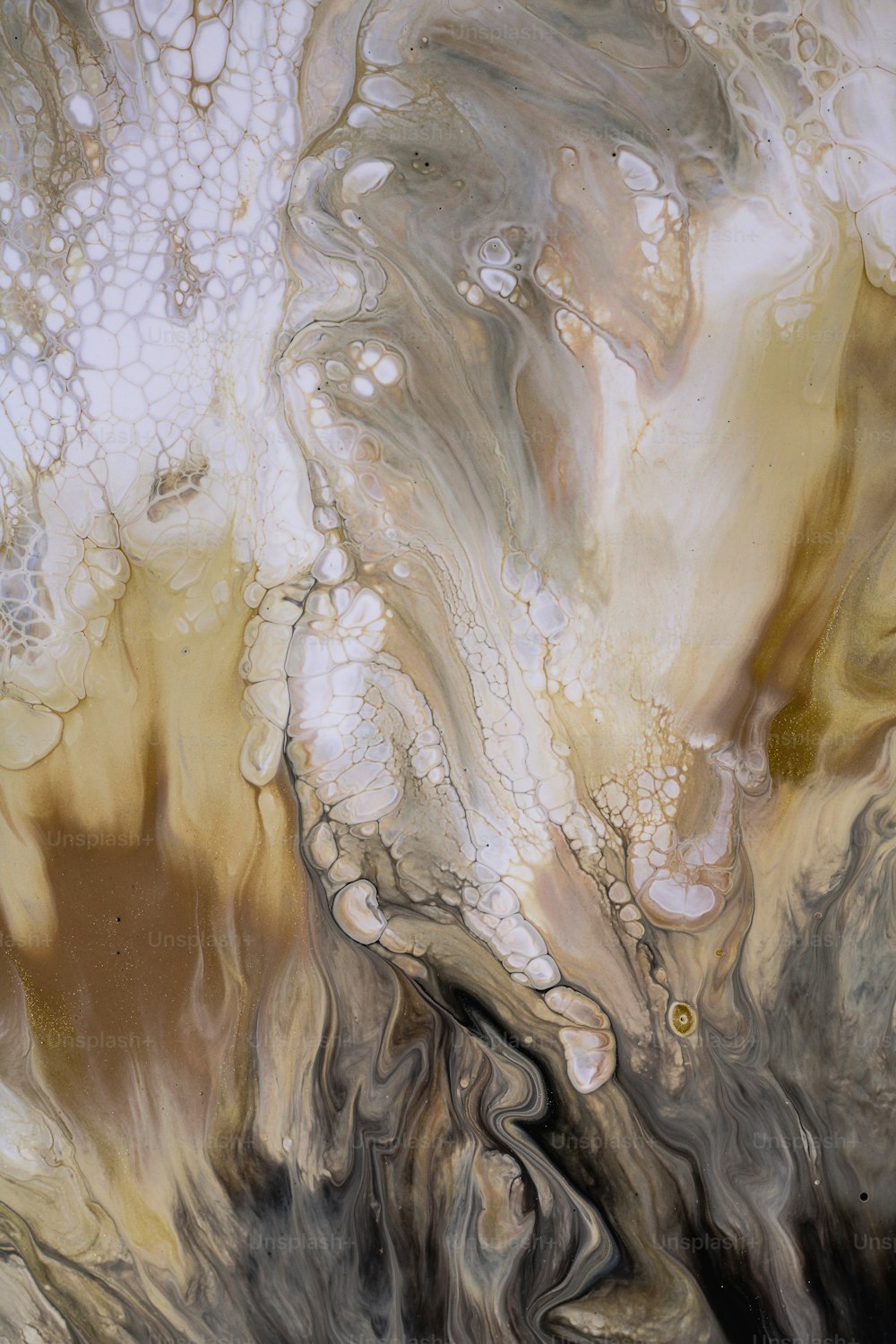 a close up of an abstract painting with brown and white colors
