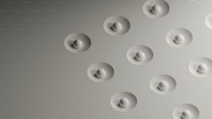 a group of white circles on a gray wall