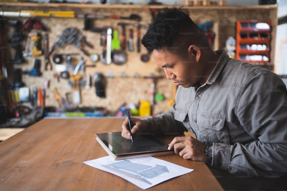 Professional technicians are designing furniture with computers.