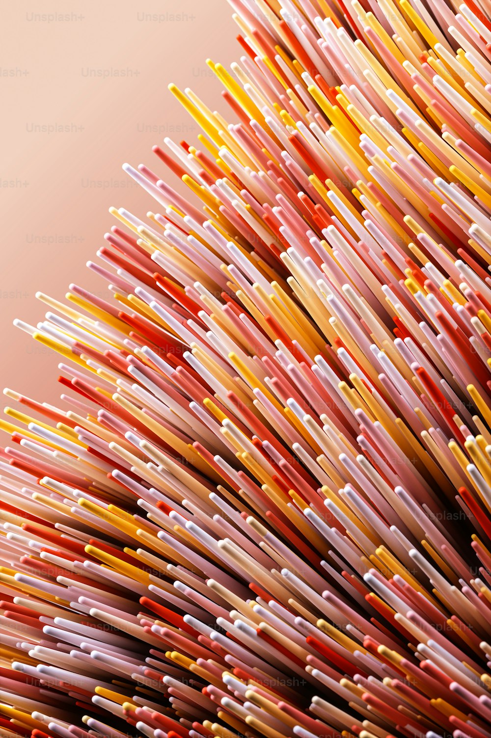 a large pile of colorful toothbrushes sitting on top of a table
