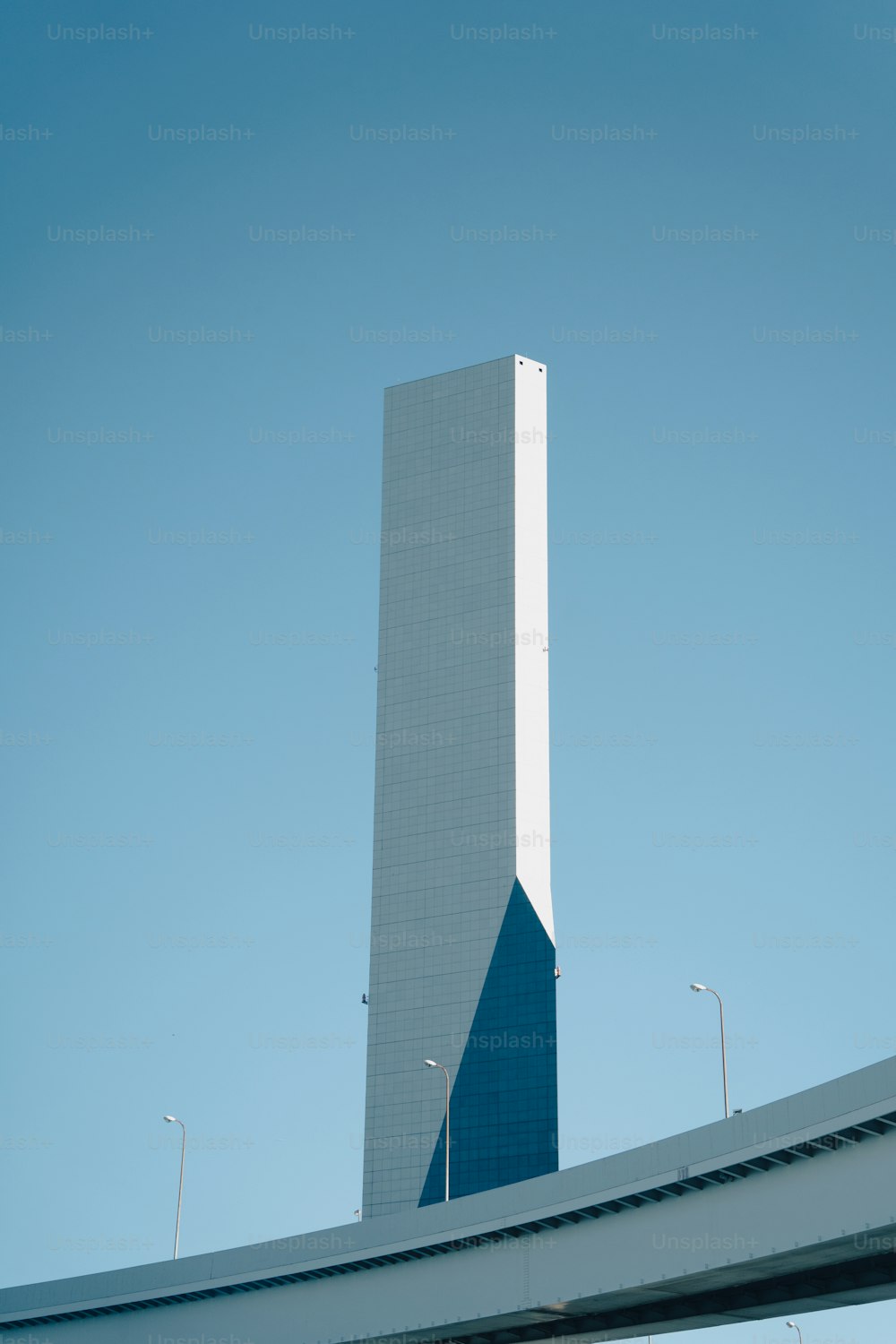 a very tall building with a sky background