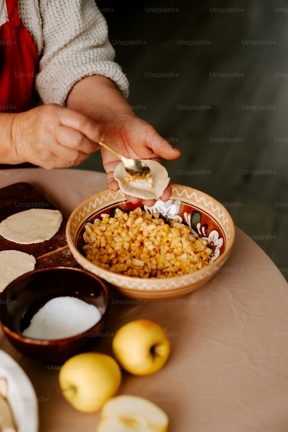 a person is putting a spoon in a bowl of food