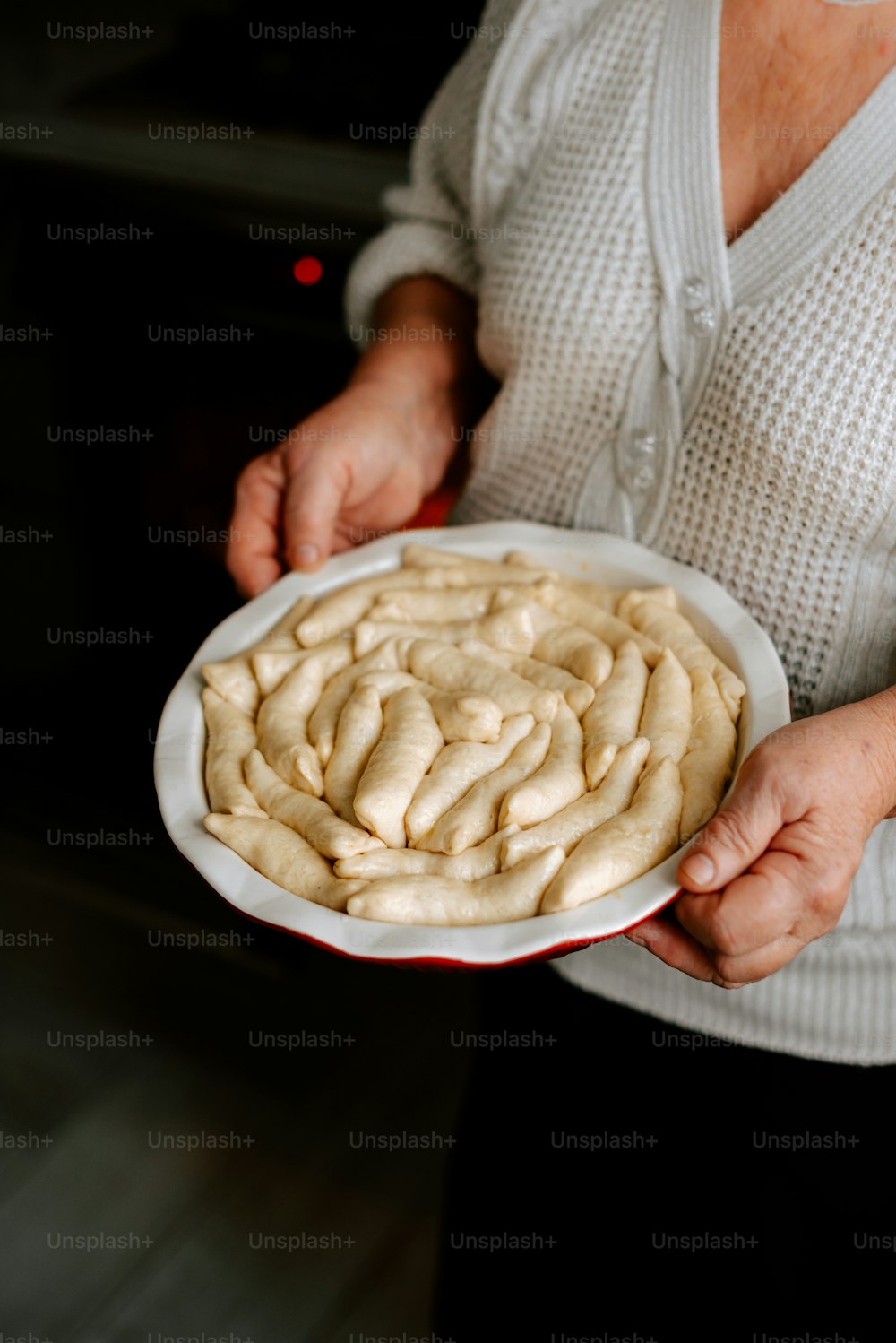 a person holding a plate of food in their hands