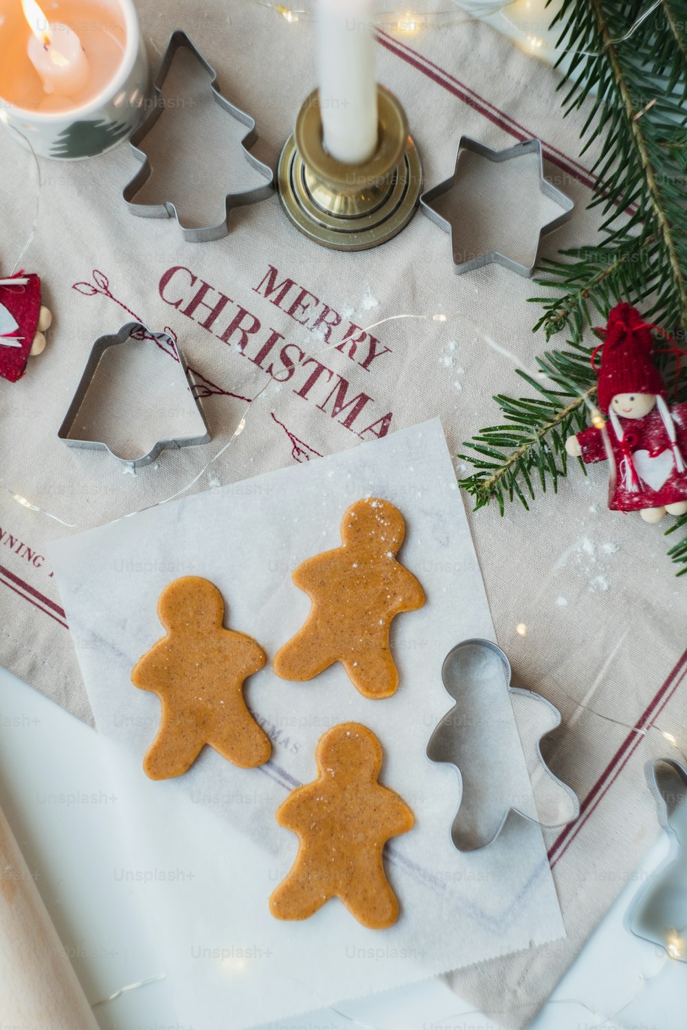 a table topped with cookies and cookies cutters