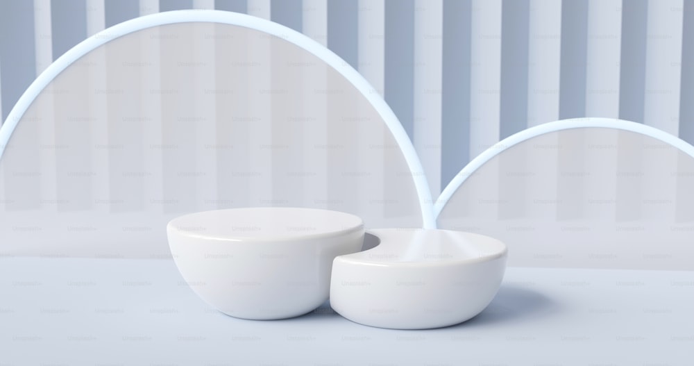 a couple of white bowls sitting on top of a table