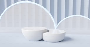 a couple of white bowls sitting on top of a table