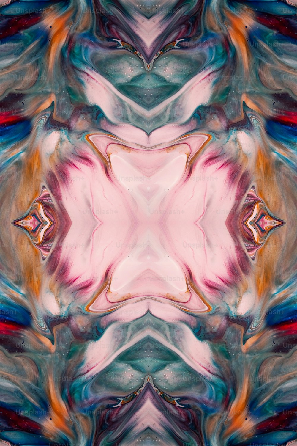 an abstract image of a pink and blue flower
