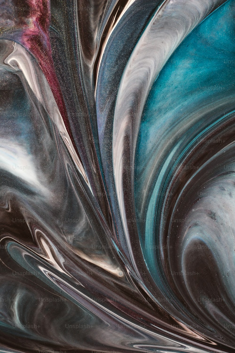 a close up of a blue and black swirl