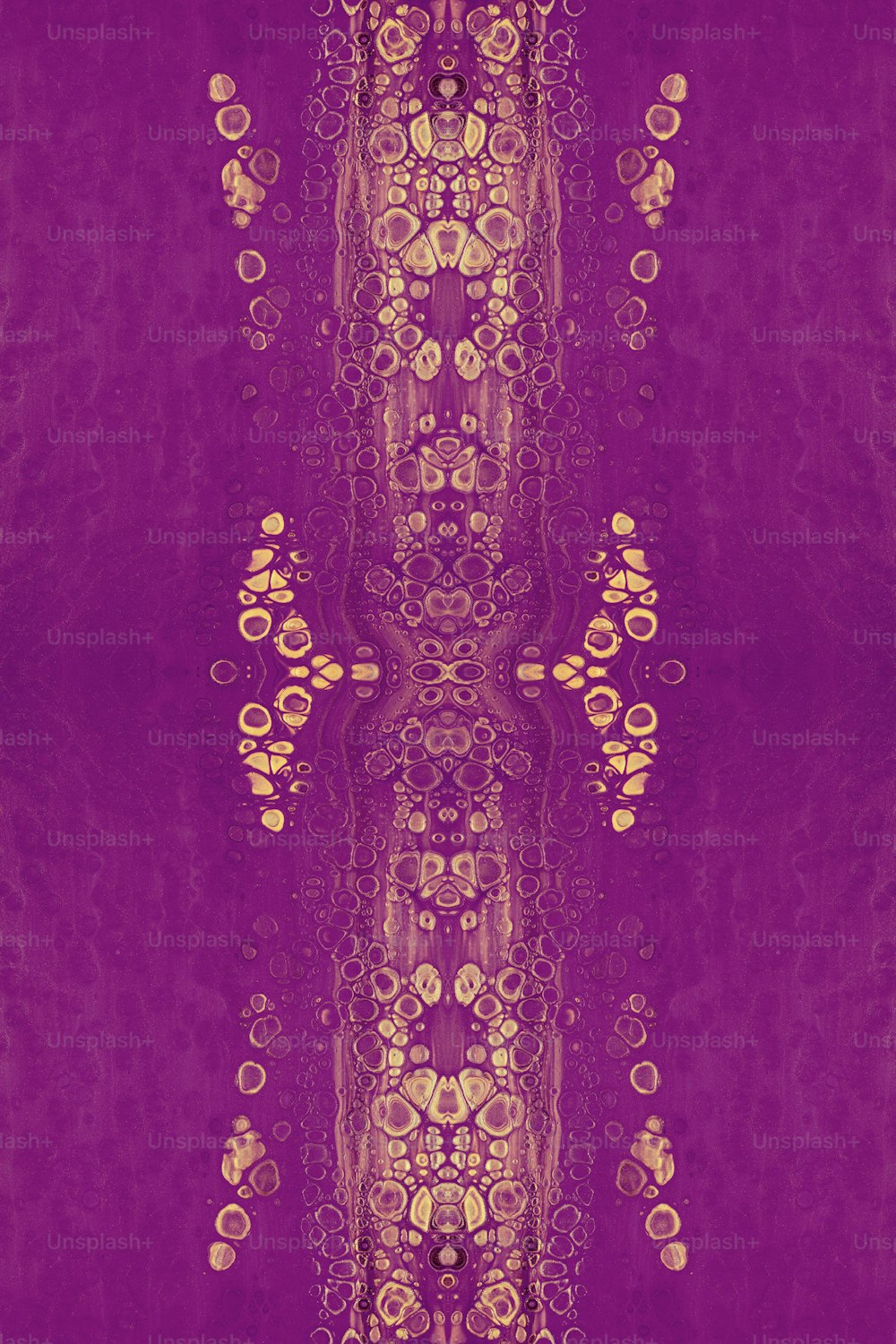 a purple background with a gold design on it