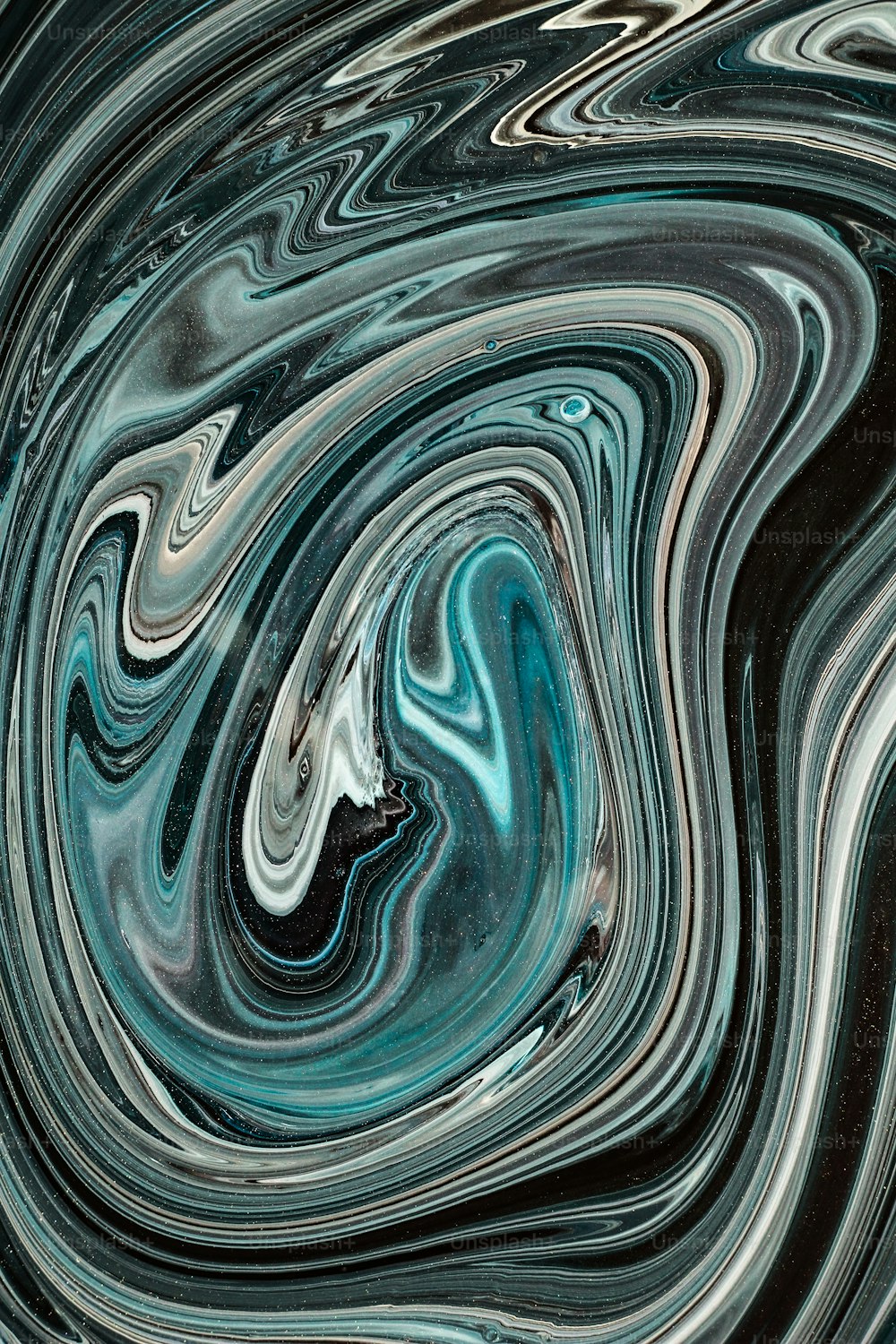 a black and white swirl with a blue center