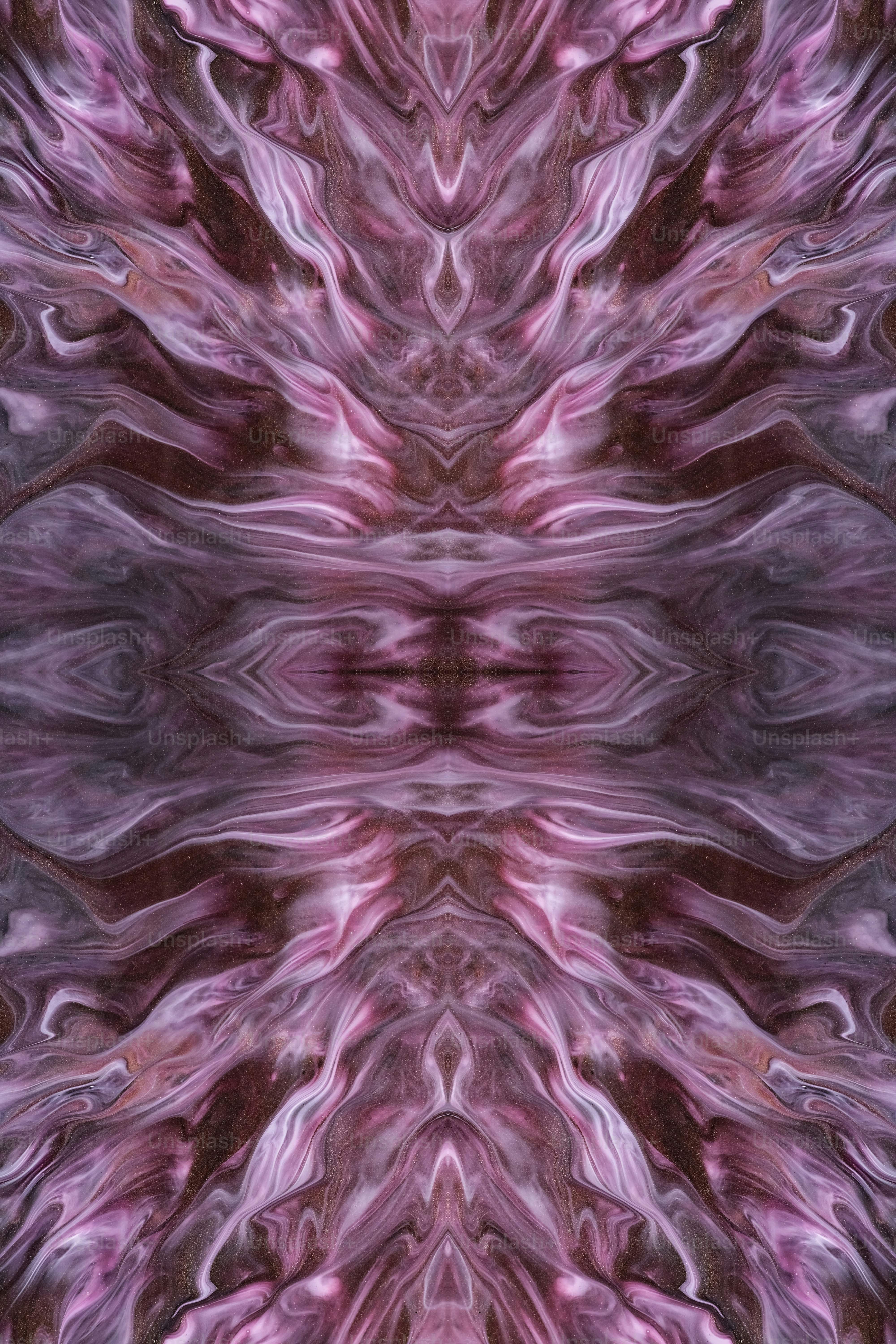 an abstract image of a pink and purple flower