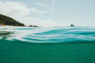 a body of water with a small island in the distance