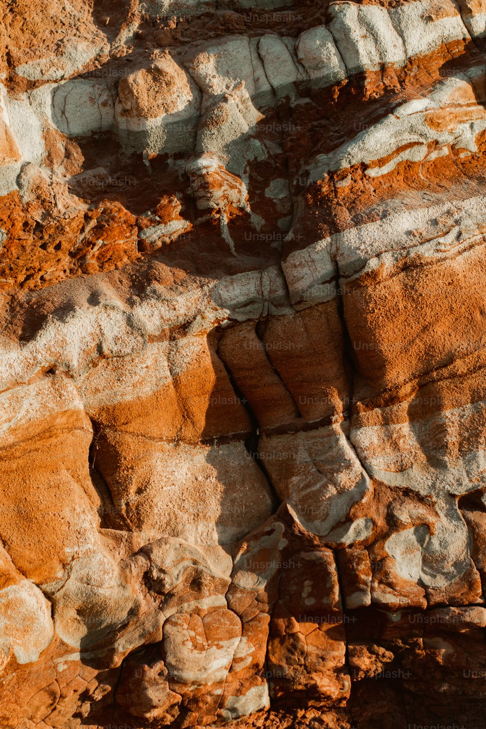 a close up of a rock formation with a sky background