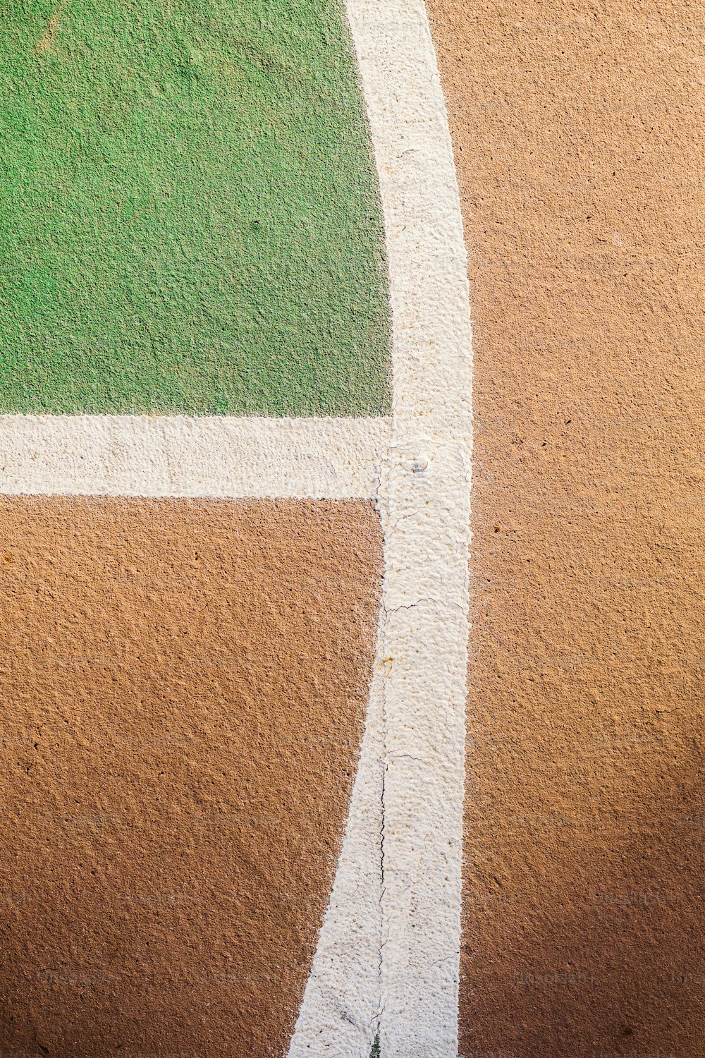 a close up of a baseball field with grass and dirt