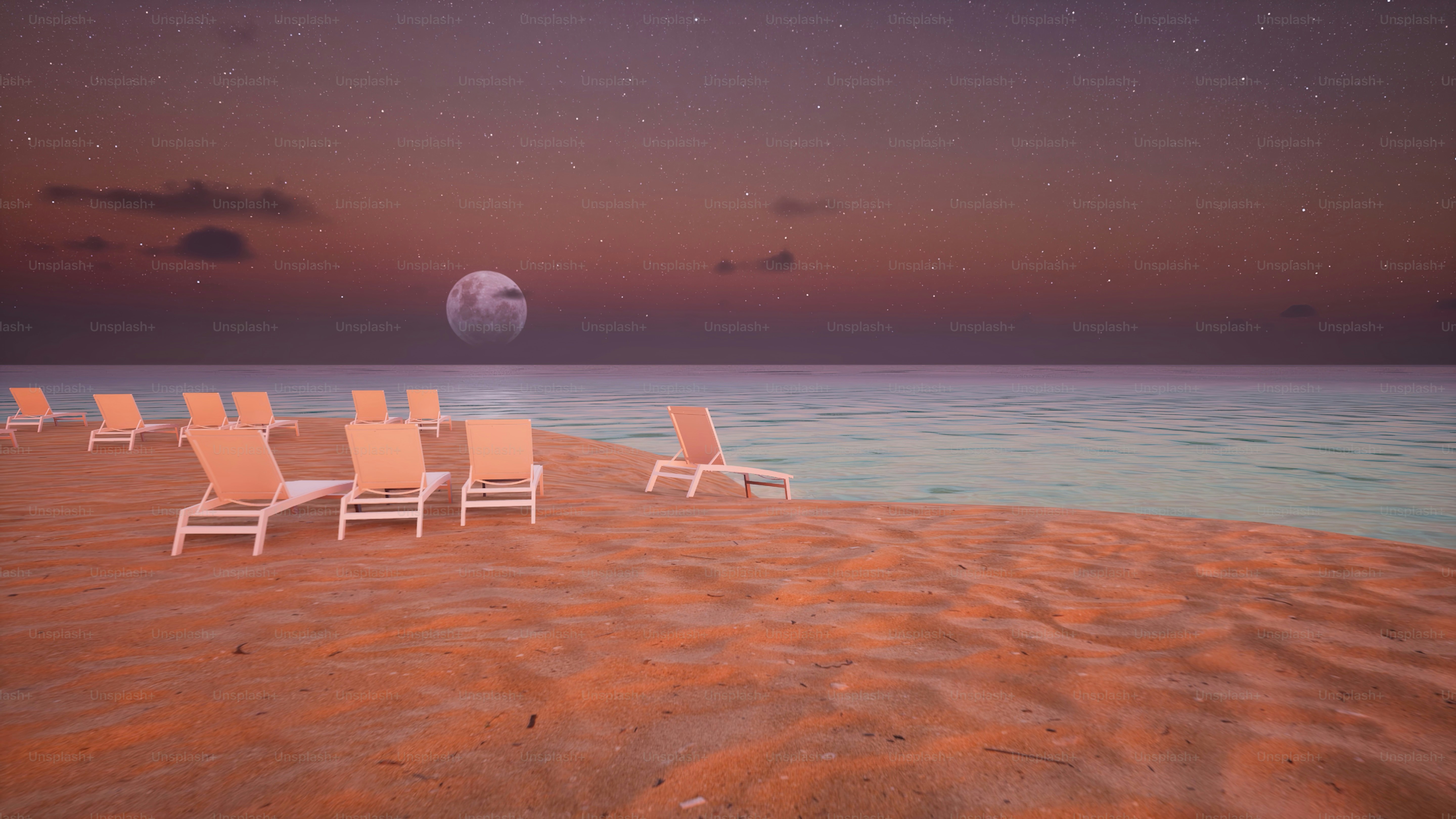 a row of lawn chairs sitting on top of a sandy beach