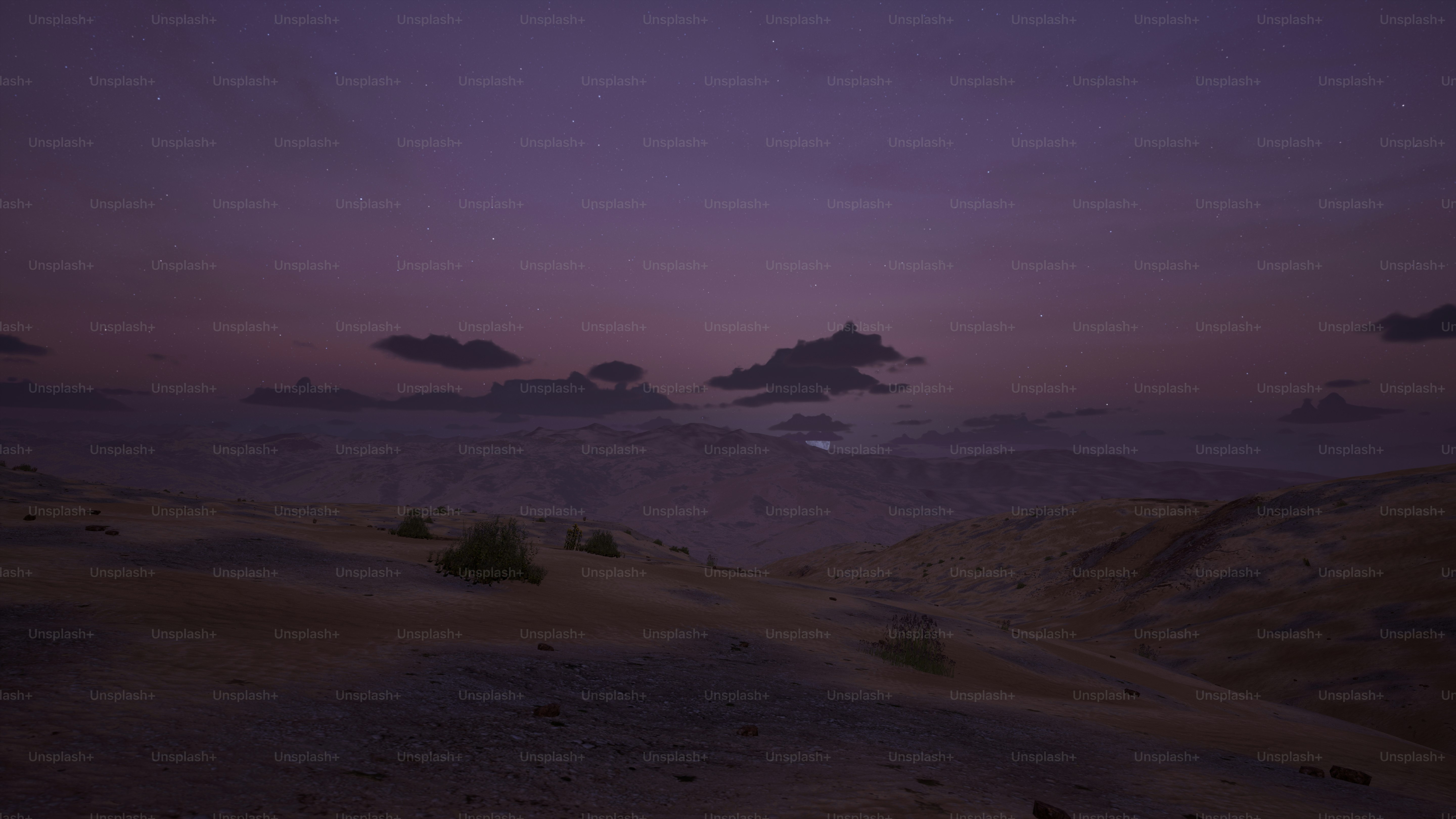 a purple sky with some clouds in the distance