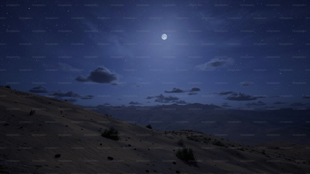 a full moon shines in the sky above a desert landscape