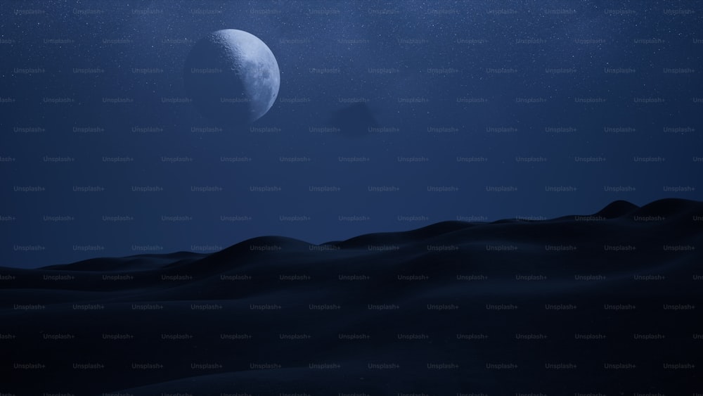 a view of the moon over a desert at night