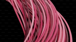 Un primer plano de un montón de cables rosados