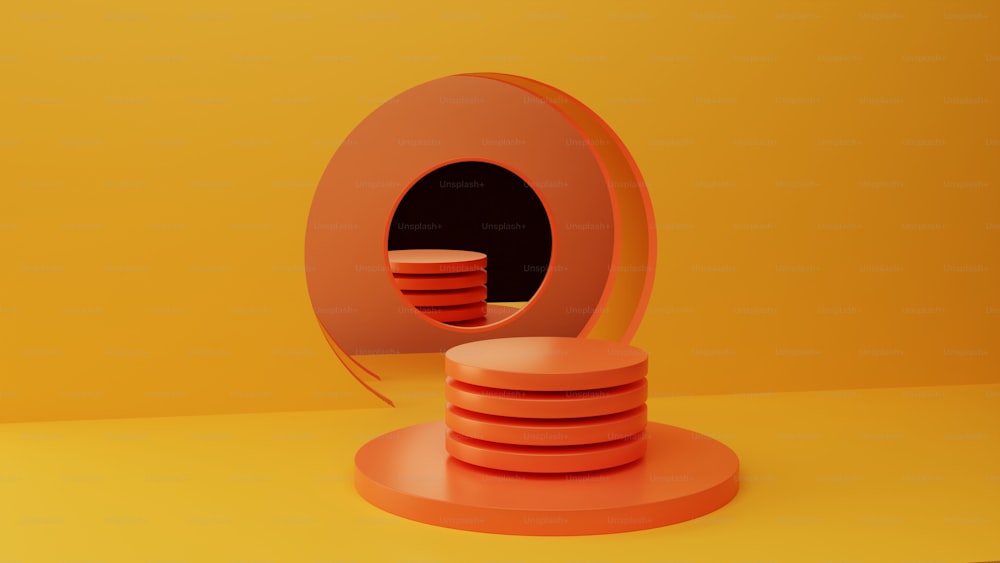 a stack of orange plates sitting on top of a yellow table
