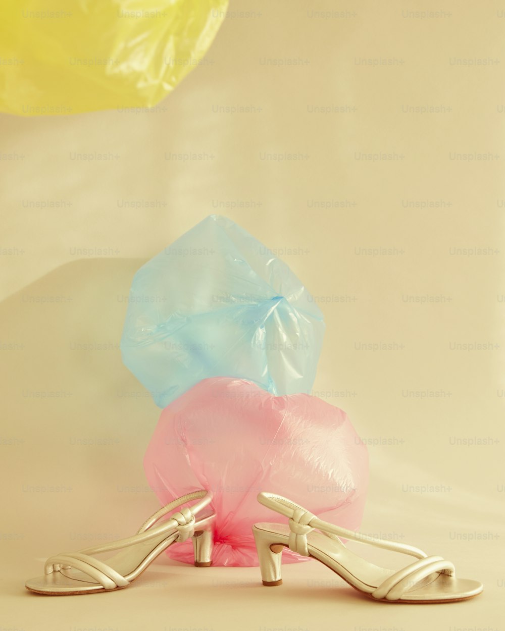 a pair of high heeled shoes sitting on top of a table