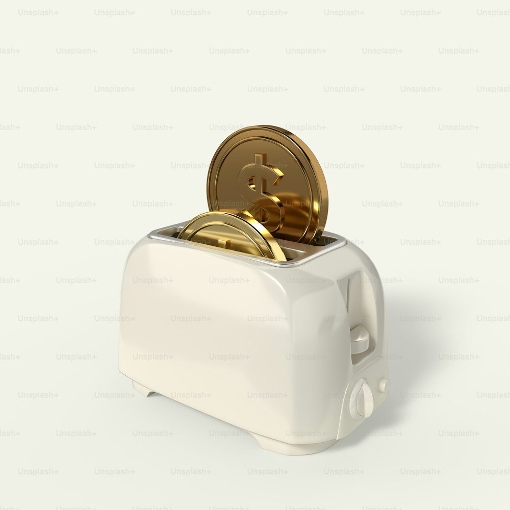 a white toaster with gold coins in it