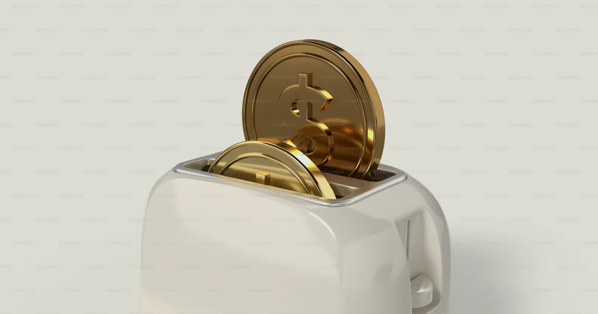Coin Toaster A white toaster with gold coins in it photo – Coins Image on Unsplash