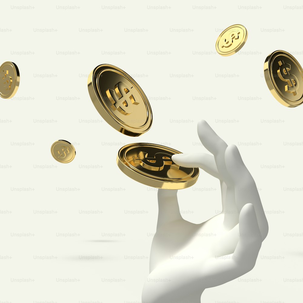 a hand holding a gold bitcoin in front of a white background