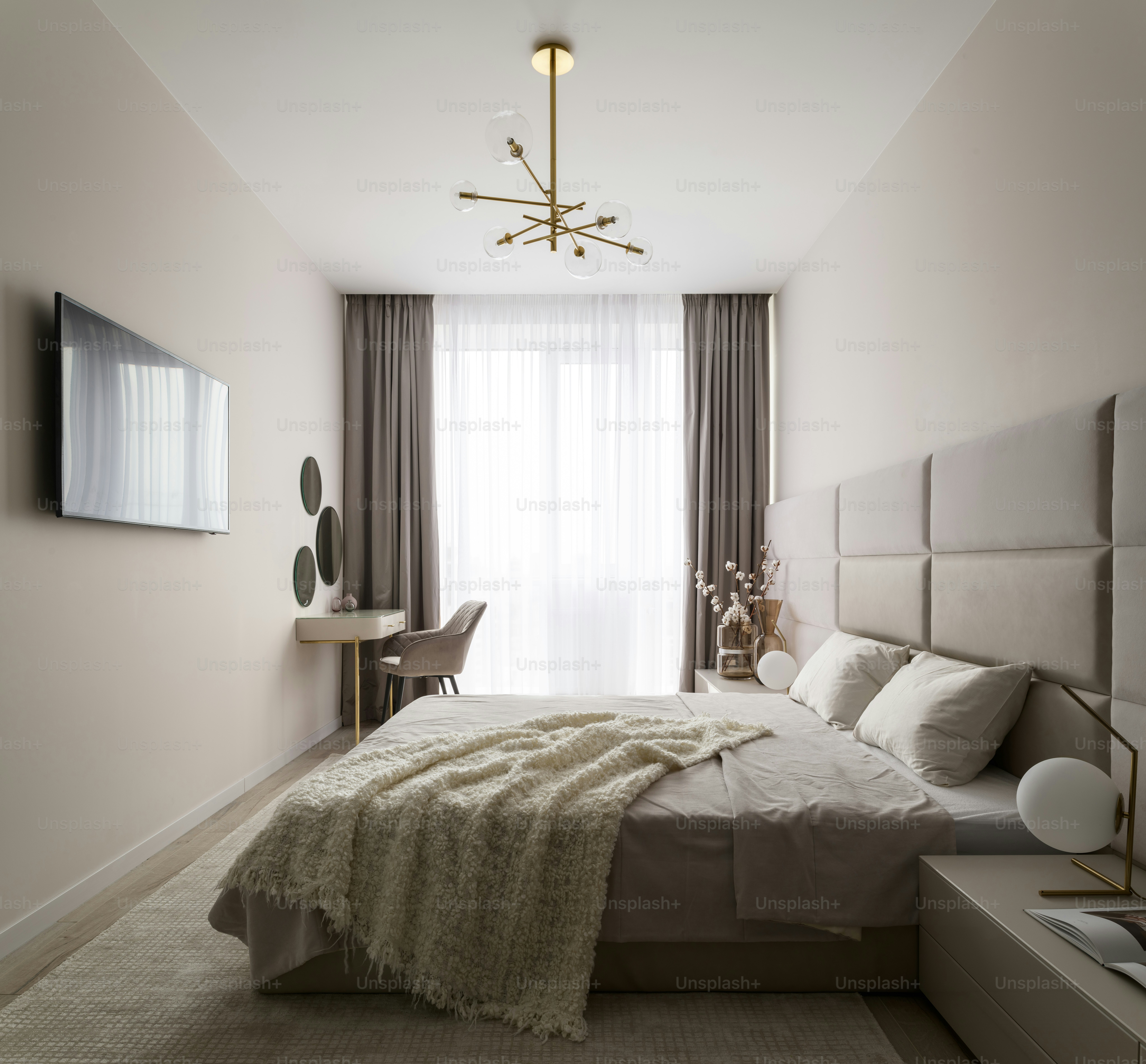 a bedroom with a large bed and a window