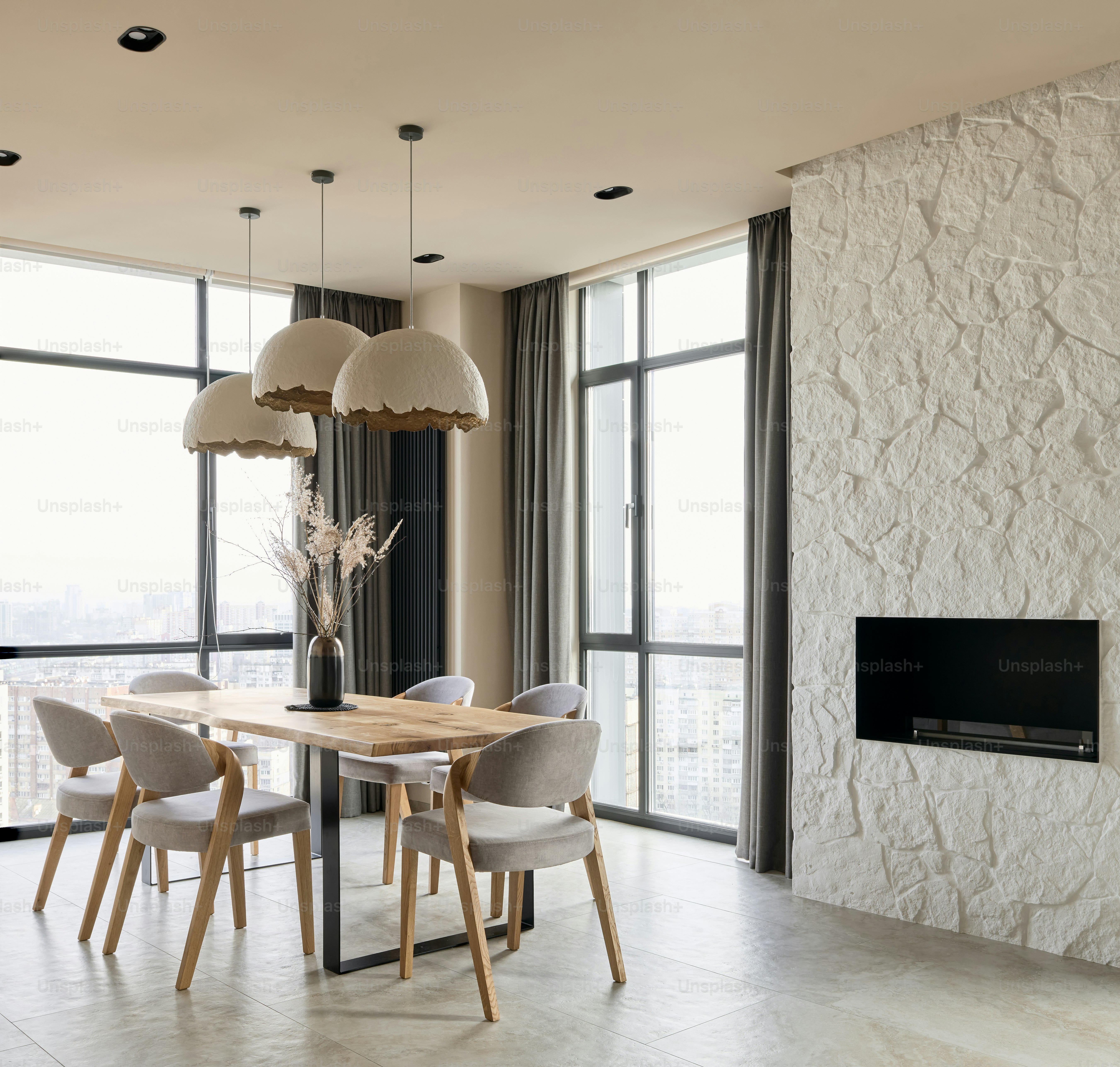 a dining room with a table and chairs