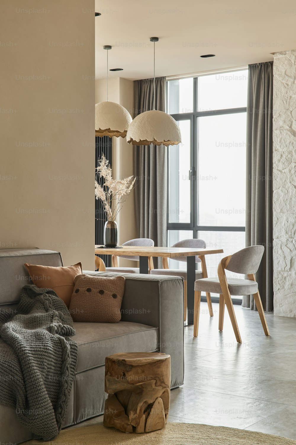 a living room filled with furniture and a table