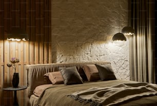 a bedroom with a bed and two lamps