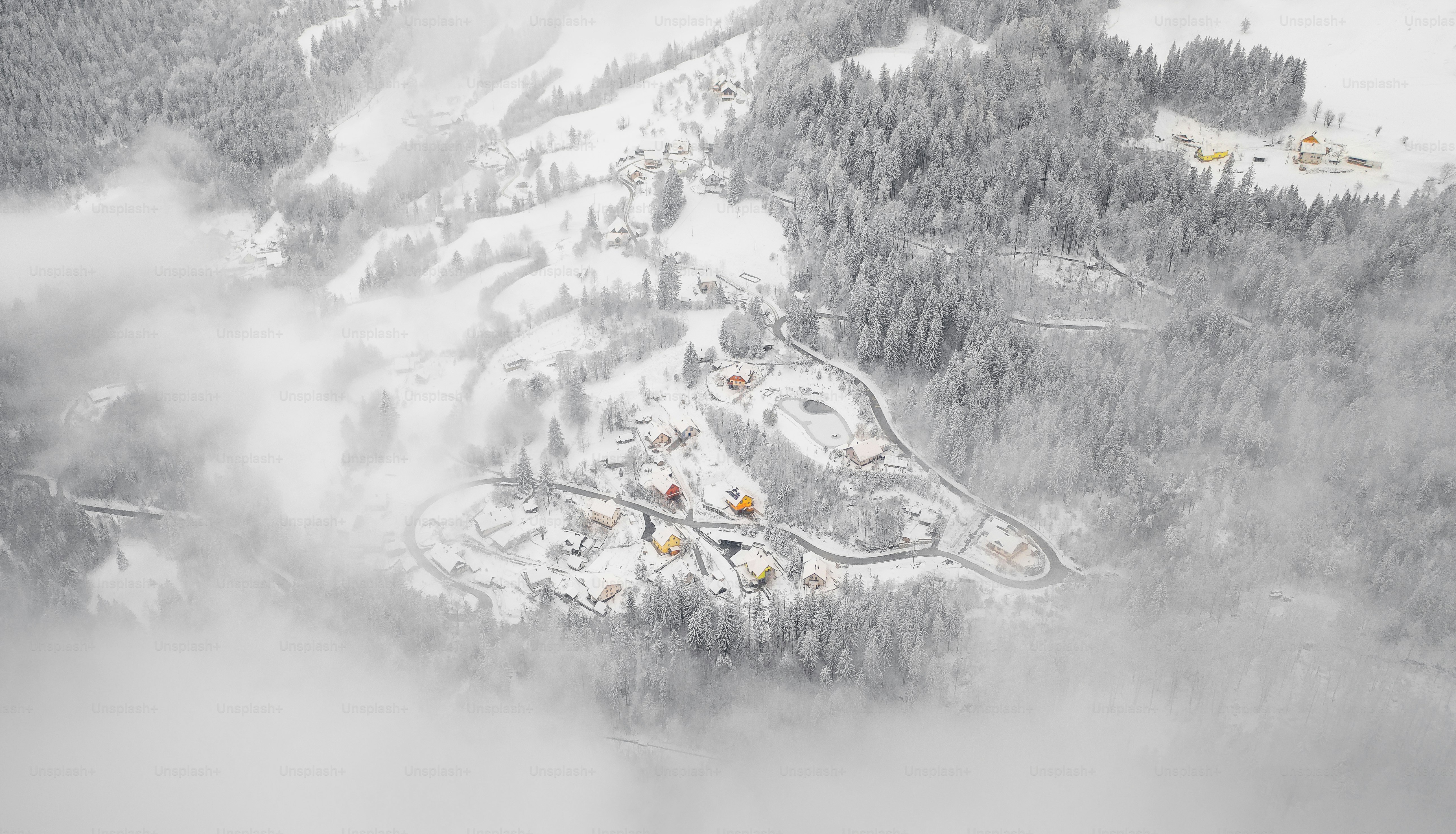 an aerial view of a ski resort in the snow