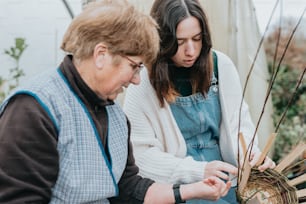 a woman and a man are looking at a basket