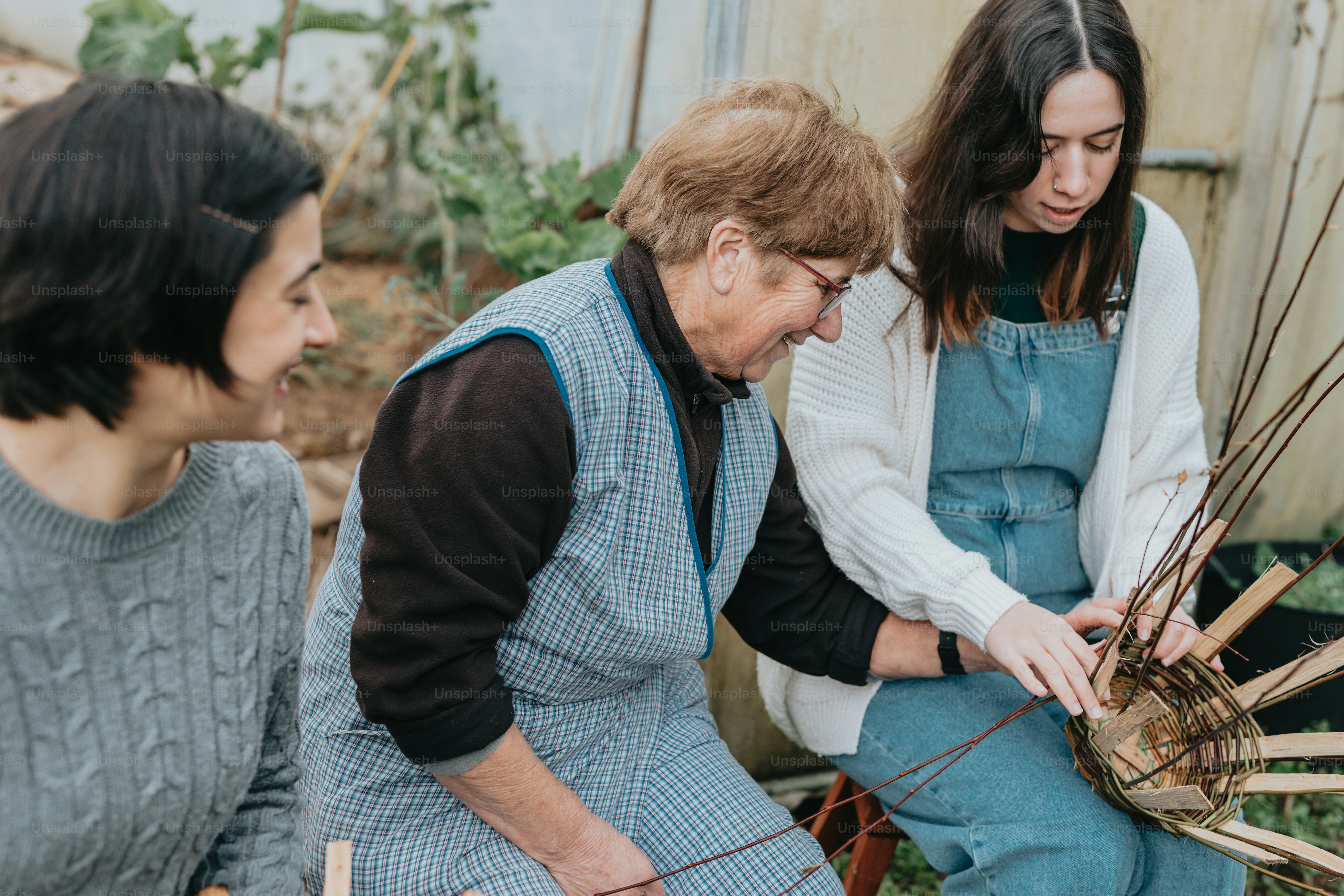 a group of women sitting around each other