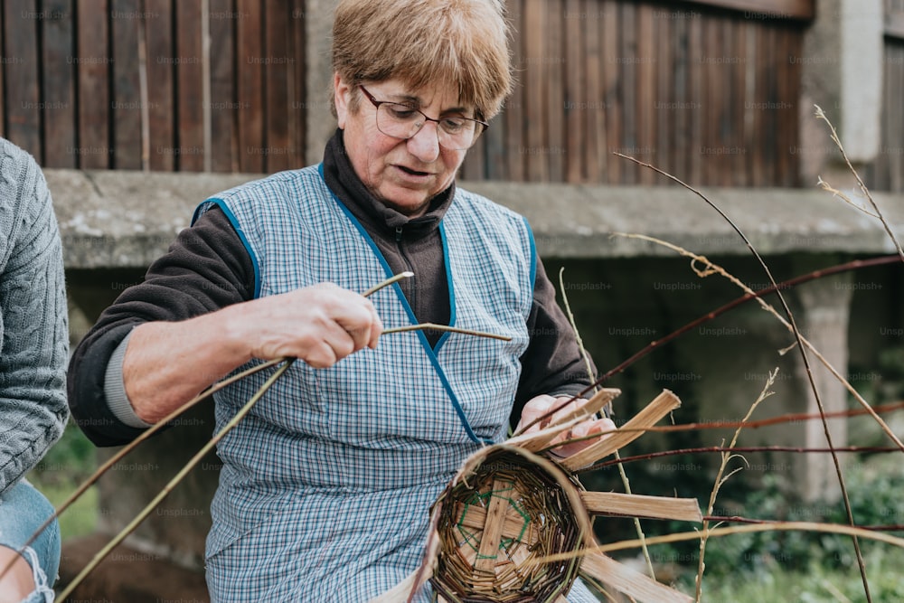 a woman is holding a basket and looking at it