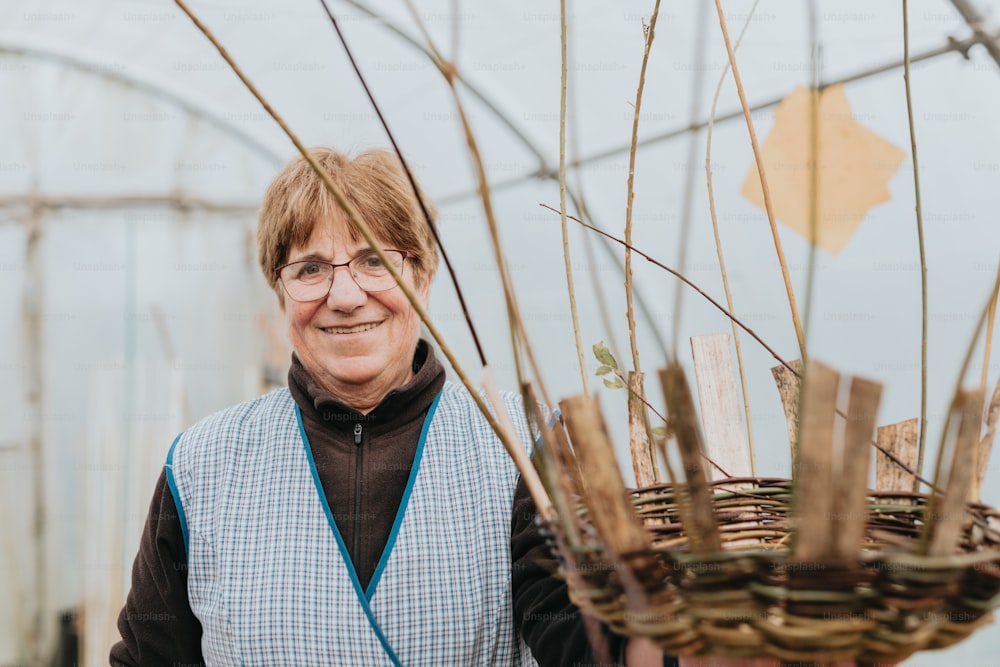 a woman standing next to a basket filled with twigs