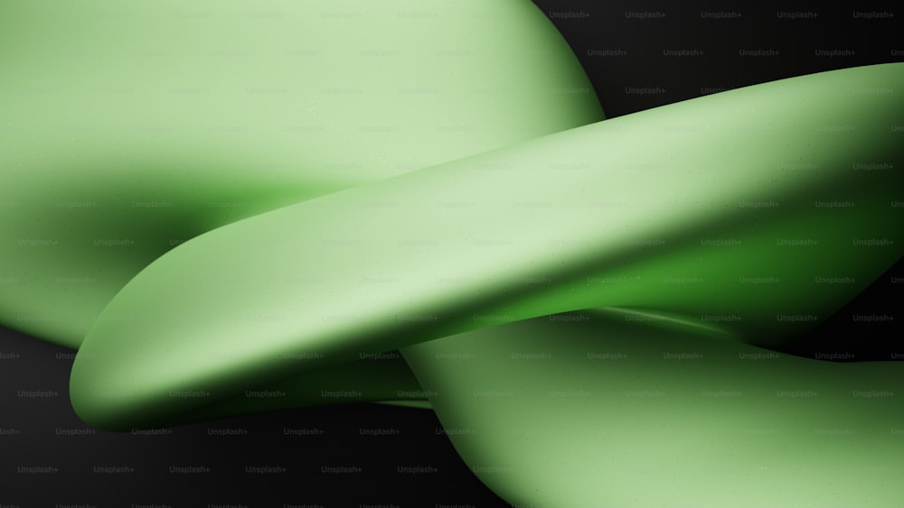 Un primer plano de un objeto verde sobre un fondo negro