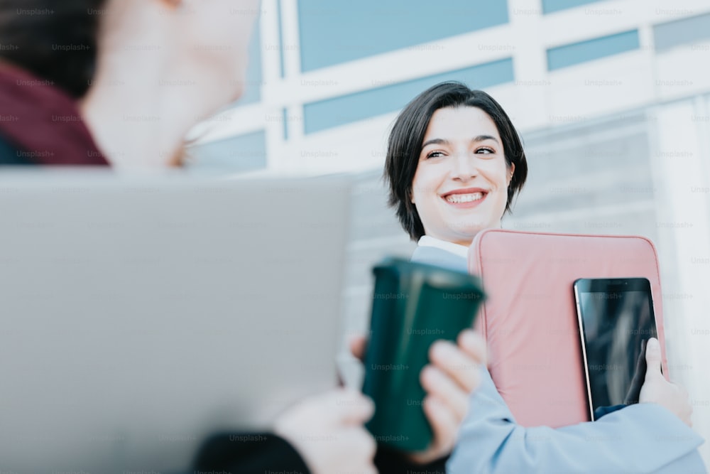 a woman is holding a folder and smiling