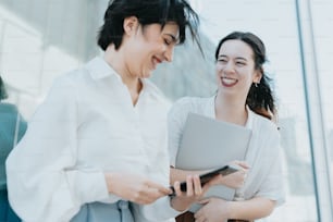 a couple of women standing next to each other