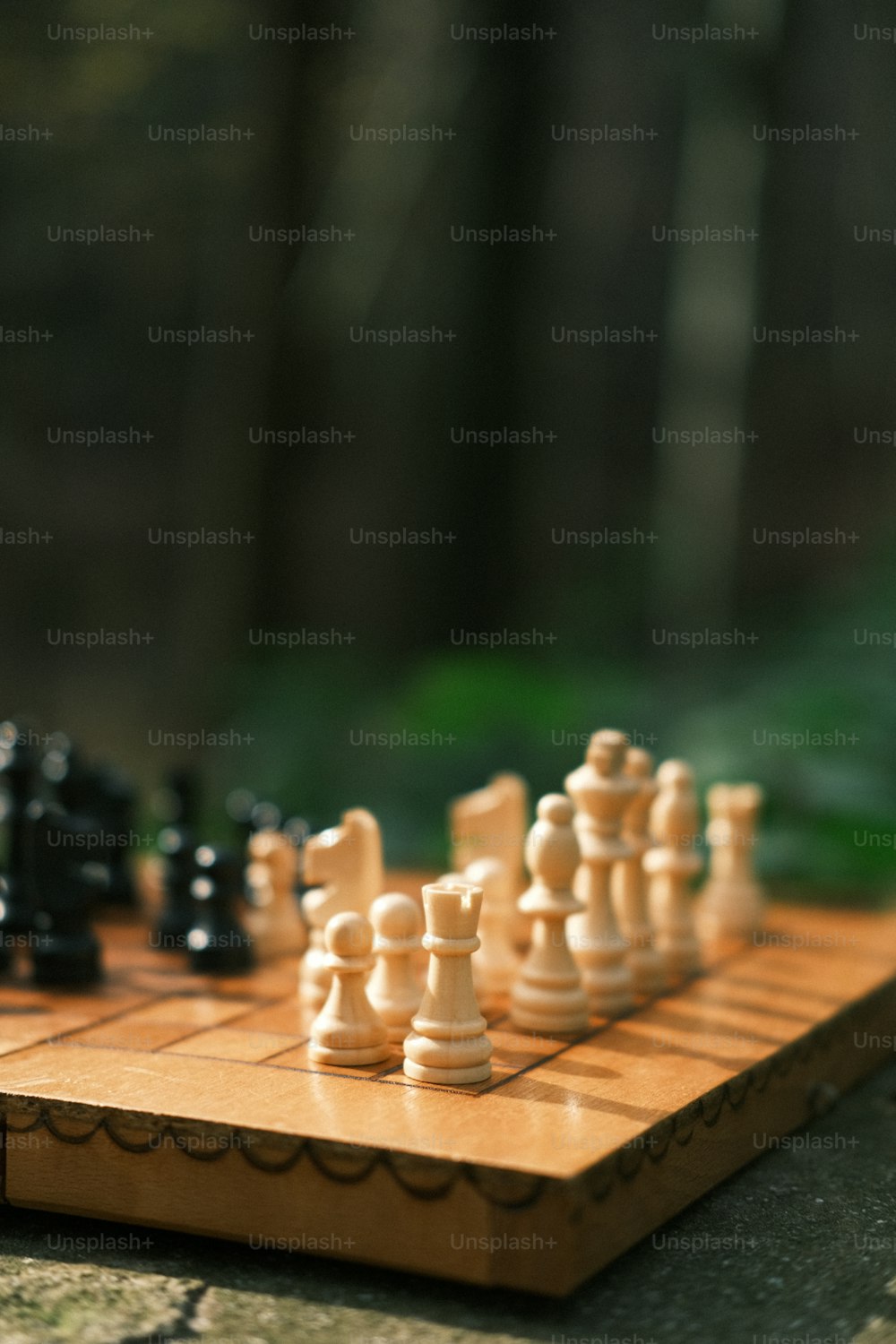 a close up of a chess board with pieces on it